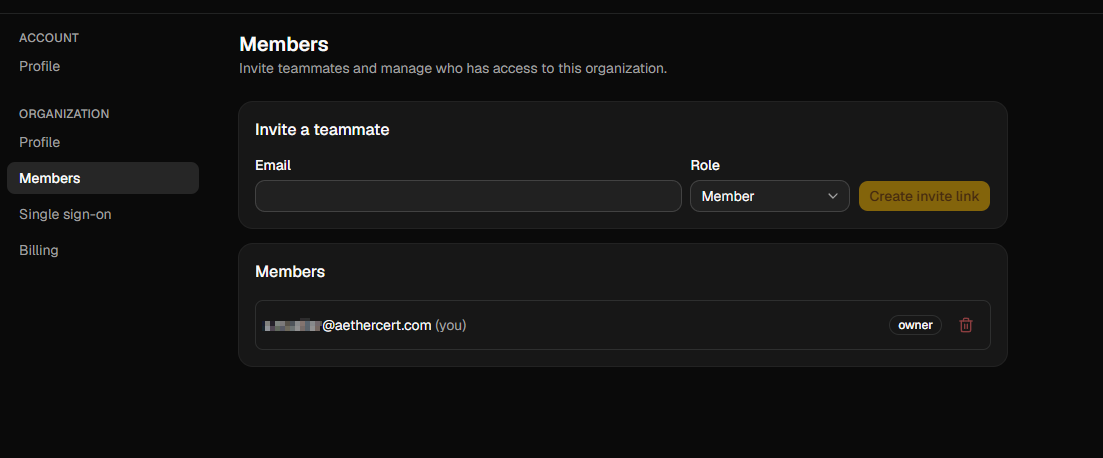 The organization members list showing each member's email address and role, with controls to change a role or remove a member.